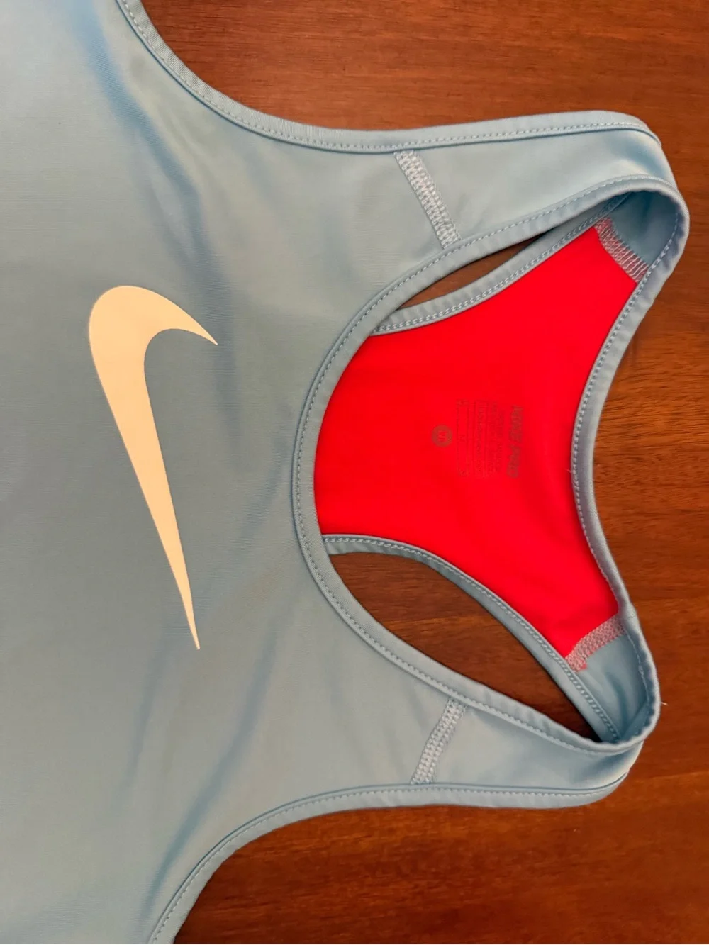 Nike Light Blue Racerback Tank with Red Interior and Yellow Swoosh